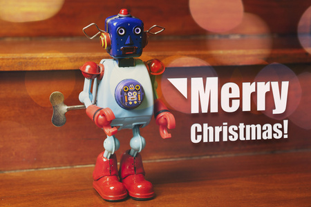 祝圣诞快乐的复古锡机器人