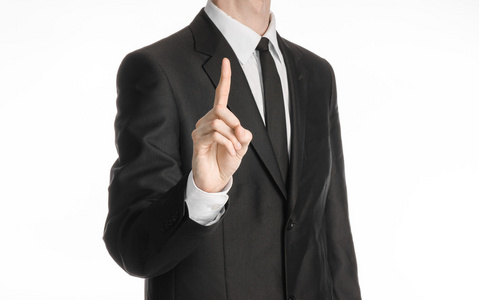 商人和手势话题一个穿着黑色西装带领带的男人