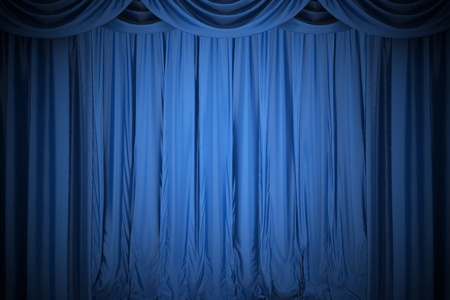 丝绸幕布蓝色的丝绸舞台幕布在剧院照片