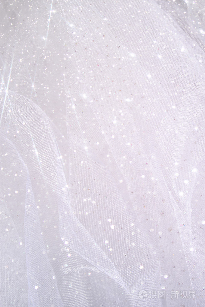 老式的薄纱雪纺纹理背景闪光覆盖了一层婚礼概念