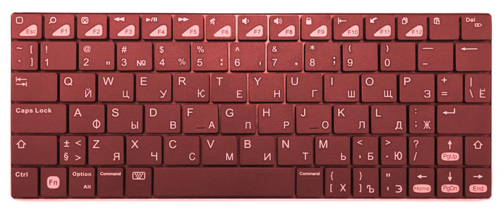 孤立的白色衬底上的橙色铬现代笔记本电脑蓝牙键盘