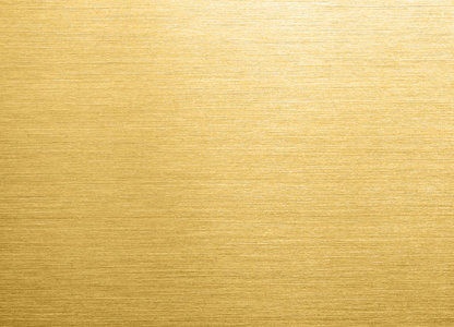纹理背景金色或黄铜拉丝金属纹理背景黄金金属纹理背景用斜行的光线