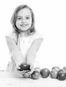 儿童或孤立的白色背景上的小女孩吃苹果