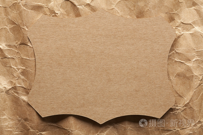 纸标签上皱巴巴的纸背景