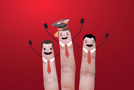 学生奋斗三个手指成功教育毕业生.概念庆祝照片