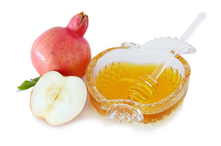 蜂蜜 石榴和苹果孤立在一张白纸。犹太新年 犹太新年假日 概念