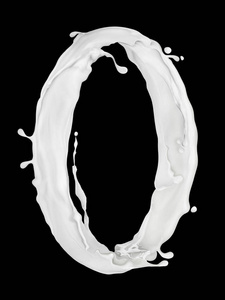 数字 0 制成的黑色背景上的牛奶飞溅照片