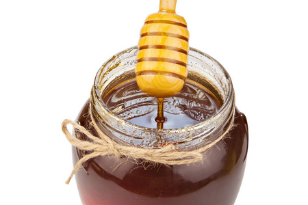 可口美味的蜂蜜在桌上的罐子里