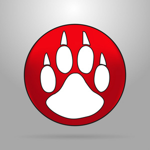 红色的圆圈背景灰色猫爪子上灰色的背景上的红色圆圈的标志照片