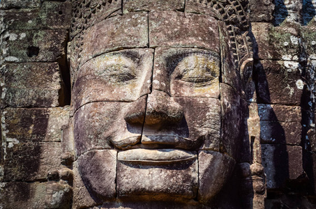 老式的石头的脸在吴哥窟巴彦寺庙的细节