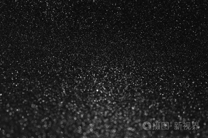 在黑色背景上的节日闪烁灯光