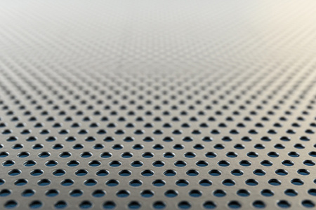带圆孔的金属背景照片