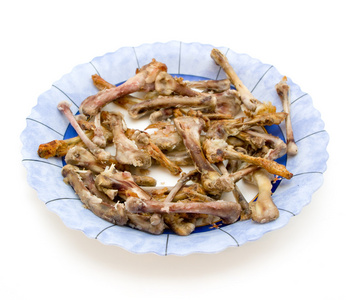 鸡翅膀孤立在白色背景板上的骨头照片