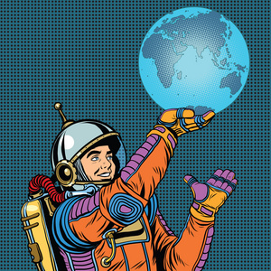 宇航员日复古宇航员手上拿着行星地球照片