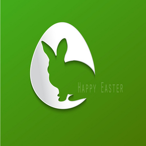 快乐的复活节庆祝活动贺卡设计与兔子剪影。绿色背景