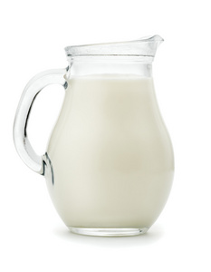 在玻璃罐中的天然全脂牛奶。