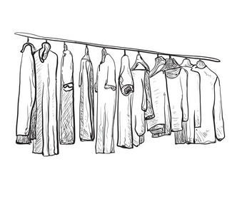 手绘衣服晾在衣架上照片