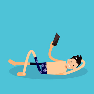人躺在海滩，看着智能手机