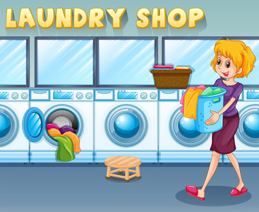 一篮衣服提着一篮洗衣店里的女人照片