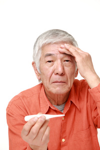 senior Japanese man with fever