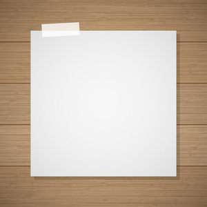 撕床单从笔记本的白色纸条叶贴在木背景照片