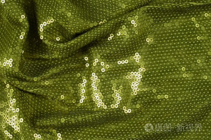 织物纹理与绿色亮片