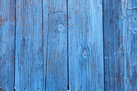 油漆剥落的老式蓝色木背景