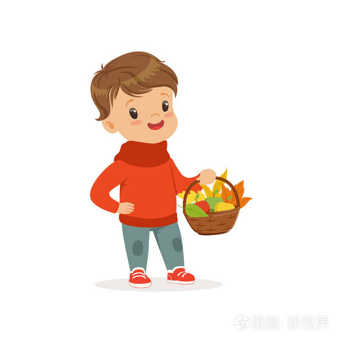 可爱的小男孩在温暖的衣物拿着篮子与苹果和枫叶