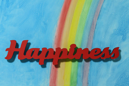 幸福这个词与七彩的虹，蓝蓝的天空背景