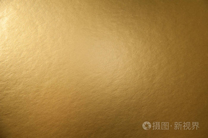 金色金属箔纸的质地设计圣诞或新年或聚会卡片的背景
