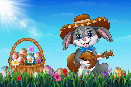 卡通兔子在花园里玩吉他, 穿着草帽照片