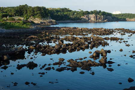 沿着奥克兰的海岸, 在日落前的渔民在奥克兰, 济州岛, 韩国