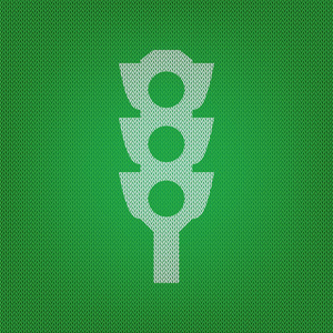 交通灯标志。白色图标上的绿色针织或羊毛 c