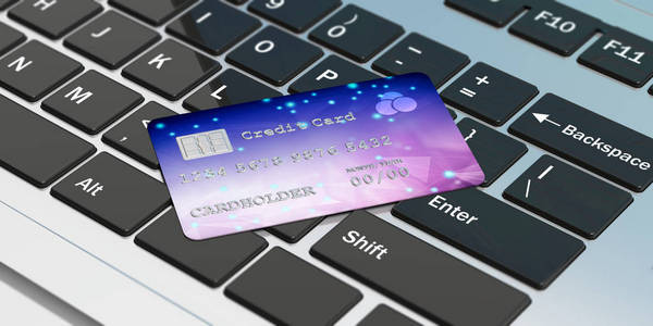 网上购物用电脑键盘上的信用卡。3d 插图