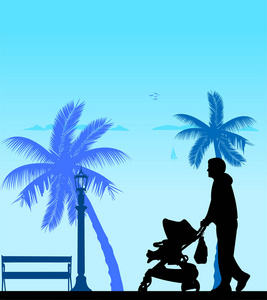 海滩上散步，与他在婴儿车中的孩子的父亲