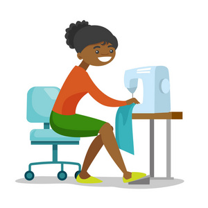 非洲年轻的裁缝缝纫机缝制照片