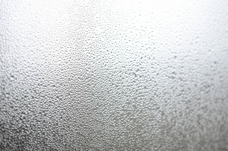 玻璃上致密凝结层的背景纹理照片