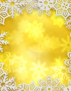 圣诞节背景。雪花在金黄的模糊背景