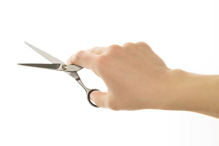 拿剪刀手中拿着剪刀剪头发上白色孤立照片