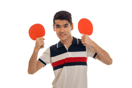 年轻英俊的运动员练习乒乓球孤立在白色背景上