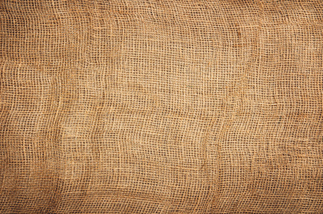 亚麻黄麻织物背景。可见的纹理