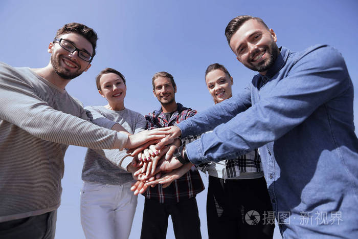 团队合作的概念.商务人士加入手照片-正版商用图片0gi0tf-摄图新视界