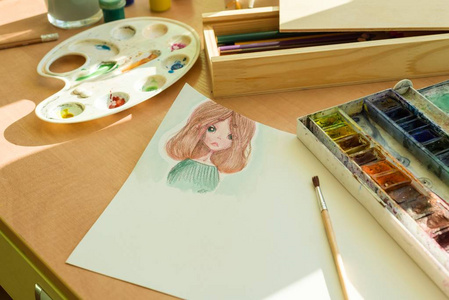 画水彩动漫女孩, 在桌子上, 水彩油漆刷