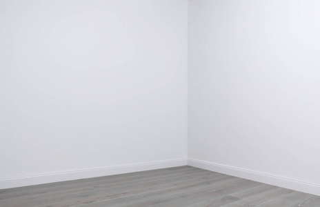 空房间角落白色的墙壁和木地板在空房间的角落里照片