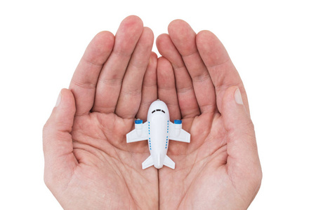白色背景小白色玩具飞机在人的手