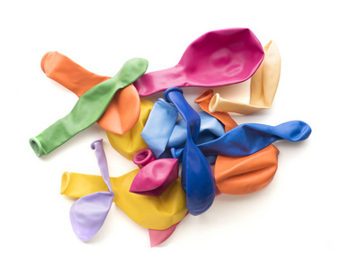 堆的多彩瘪的橡胶气球上白色孤立照片