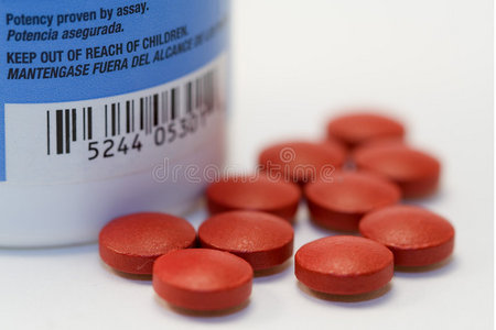红色药丸和警告照片