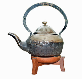 木支架上的古代茶壶。