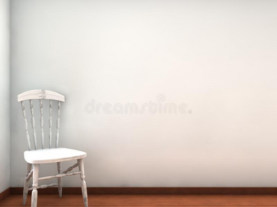 椅子面对一堵空白的白墙