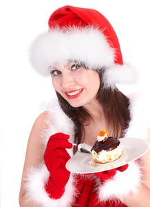 圣诞女孩戴着红色圣诞帽，盘子里放着蛋糕。